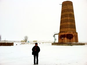 The author in front of Burana Tower in Tokmok, Kyrgyzstan. Tokmok has a sizeable Chechen population.