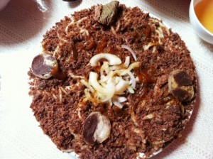 Issyk Kul Beshbarmak (long noodles with crumbled horsemeat, topped with horse meat slices and intestine rings )