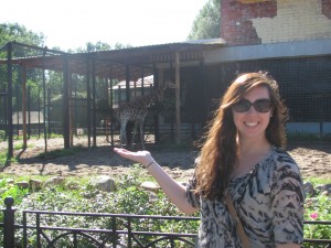In front of the giraffe enclosure