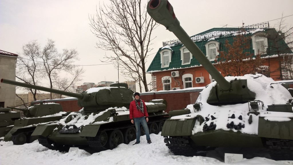 Standing beside a Soviet T34-85 tank from World War II.