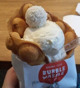 A vanilla waffle with apples, cinnamon, and ice cream at Bubble Waffle.