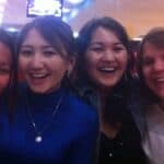 The author, on the far right, is pictured with some of the many cousins she has met. In this photo, she is teaching the Kazakh girls how to smile like Americans!